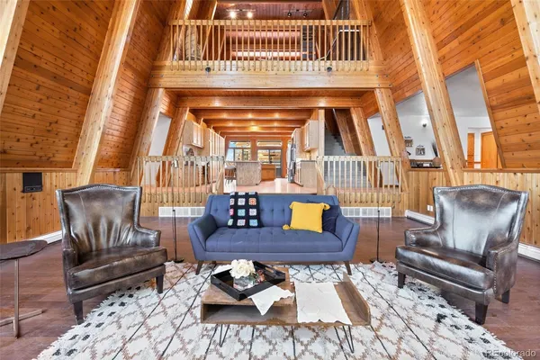 a living room with furniture and a rug