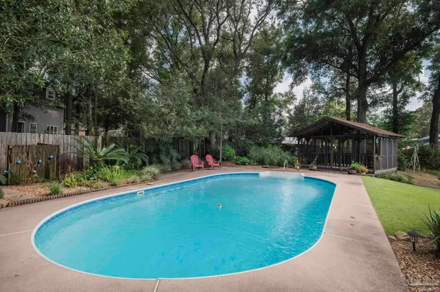 a view of a swimming pool with a patio