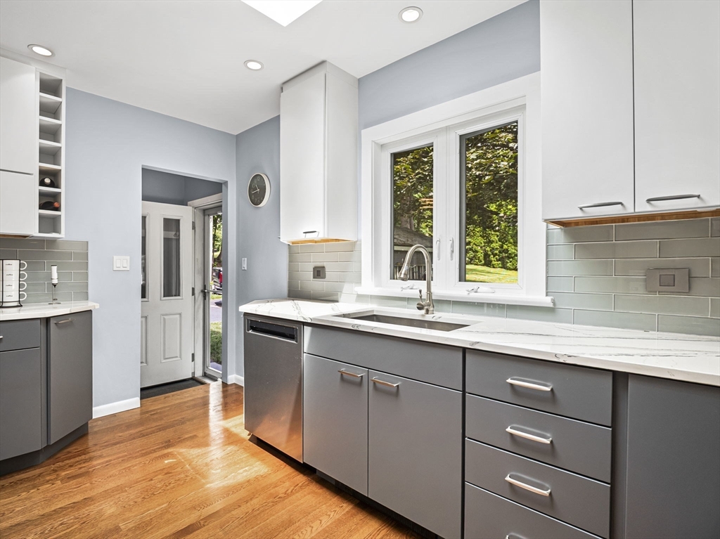 44 Locust Street Merrimac, MA 01860 - Photo 17 of 42 a kitchen with a sink window and cabinets