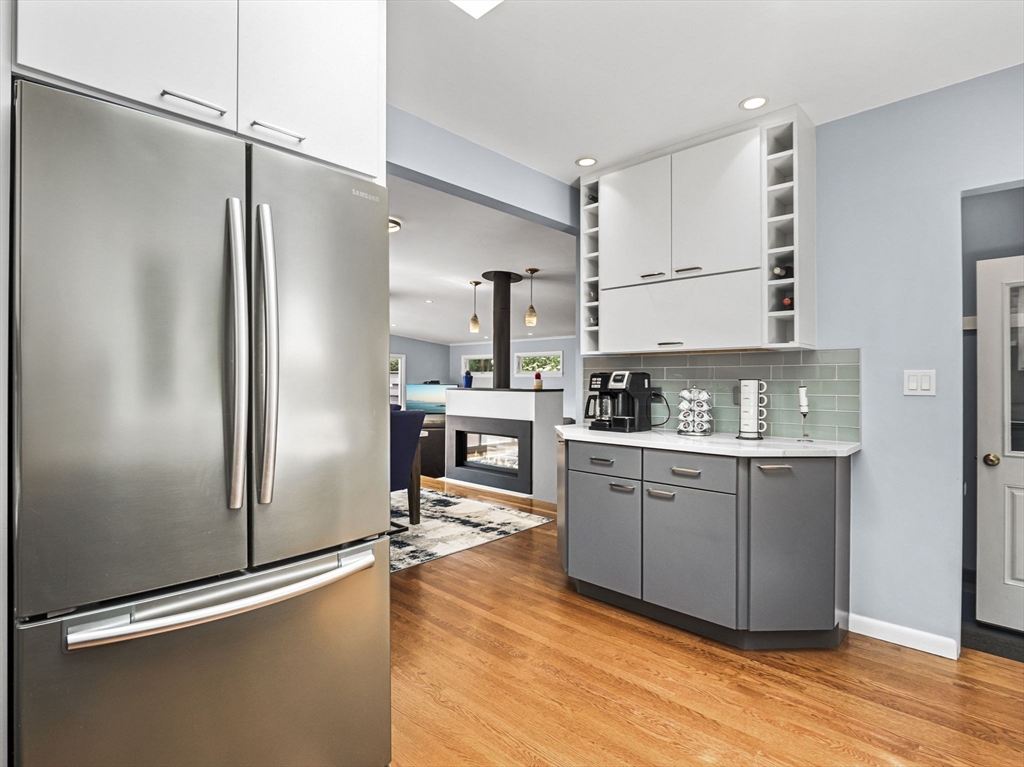 44 Locust Street Merrimac, MA 01860 - Photo 18 of 42 a kitchen with granite countertop a refrigerator and a sink