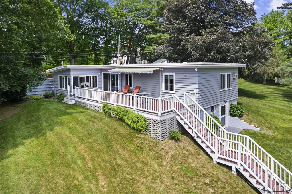 44 Locust Street Merrimac, MA 01860 - Photo 2 of 42 a front view of a house with garden