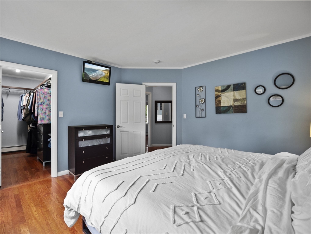 44 Locust Street Merrimac, MA 01860 - Photo 21 of 42 a bedroom with a large bed and dresser