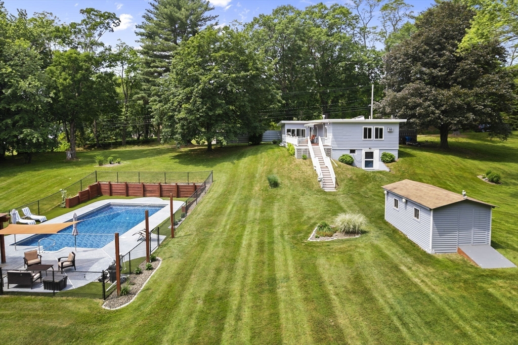 44 Locust Street Merrimac, MA 01860 - Photo 29 of 42 a view of a swimming pool with a patio