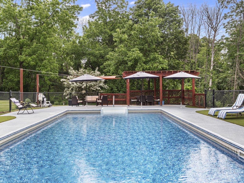 44 Locust Street Merrimac, MA 01860 - Photo 32 of 42 a view of a swimming pool with a patio