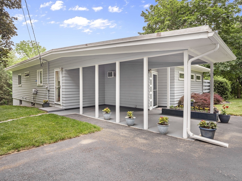 44 Locust Street Merrimac, MA 01860 - Photo 5 of 42 front view of a house with a patio