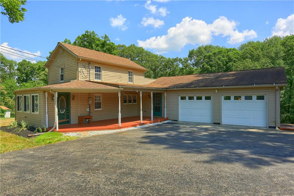 gorgeous setting with two car attached garage. Great covered front porch with access to entry or living room.  