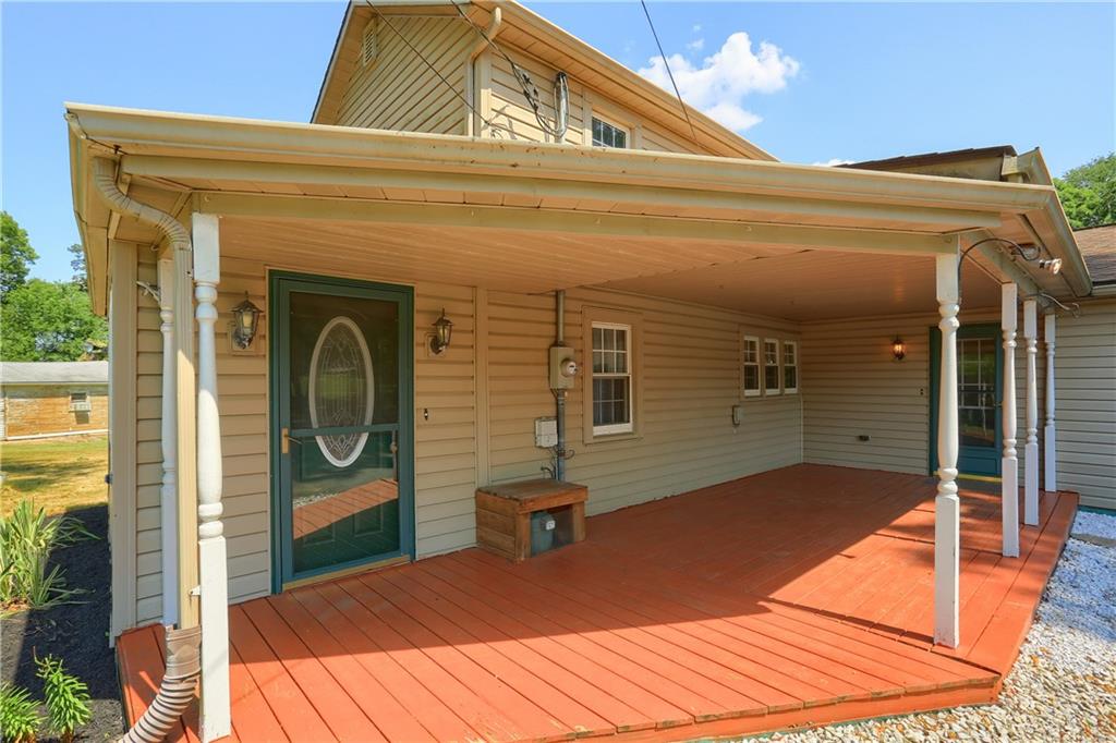 1261 Highway 989 Rochester, PA 15074 - Photo 3 of 25 Large front porch perfect for your morning coffee on your rocking chairs.