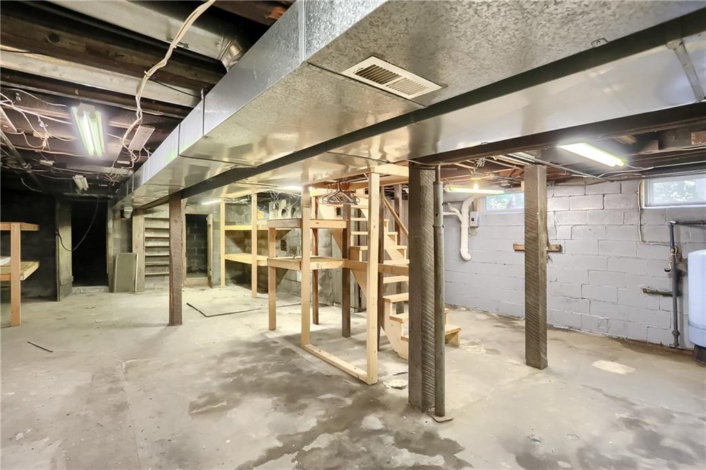 1261 Highway 989 Rochester, PA 15074 - Photo 23 of 25 Basement has huge storage area with built in shelving
