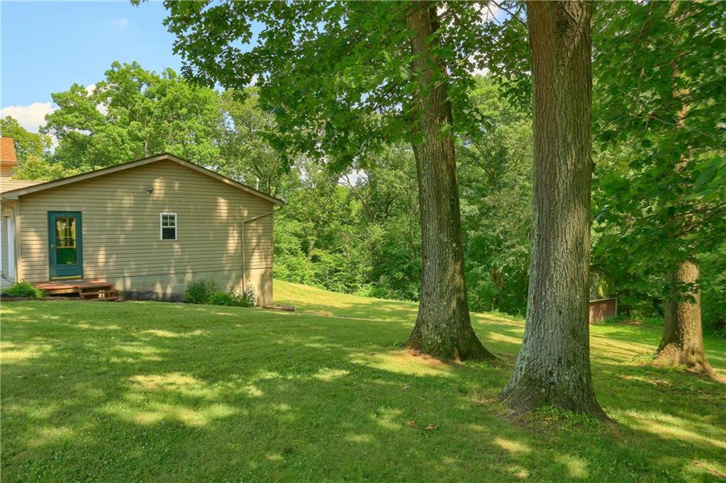 1261 Highway 989 Rochester, PA 15074 - Photo 25 of 25 Beautiful side yard with door leading to the garage.