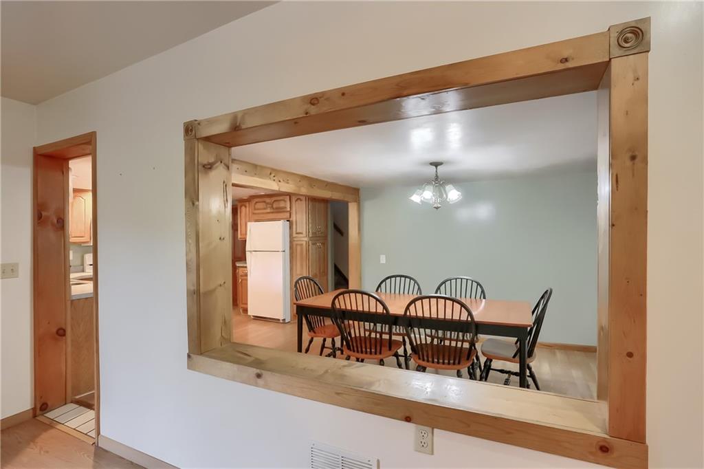 1261 Highway 989 Rochester, PA 15074 - Photo 9 of 25 Look at the beautiful woodwork with beamed ceiling from kitchen to dining room.