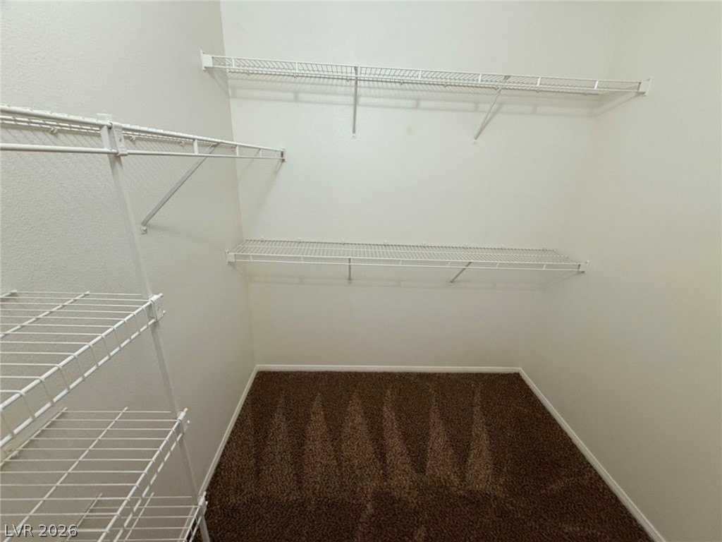2050 West Warm Springs Road, Unit 3521 Henderson, NV 89014 - Photo 6 of 12 Functional wire shelving and soft carpeting define this practical closet space.