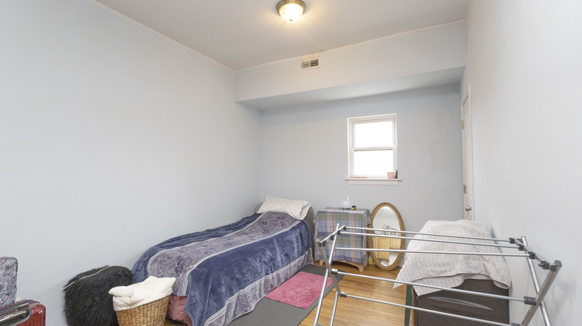 3612 West Roosevelt Road Chicago, IL 60624 - Photo 15 of 32 a room with a bed and a dresser