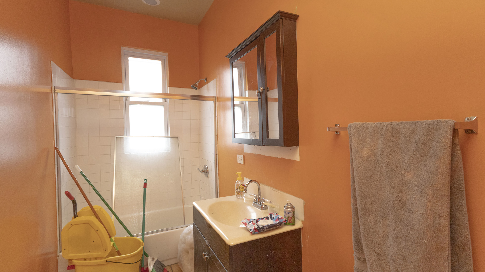 3612 West Roosevelt Road Chicago, IL 60624 - Photo 18 of 32 a bathroom with a sink and mirror with bathtub
