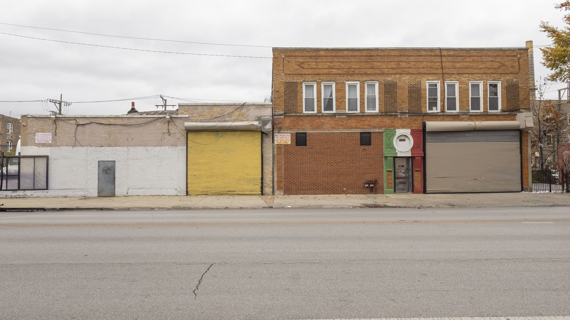 3612 West Roosevelt Road Chicago, IL 60624 - Photo 2 of 32 a front view of a house with a road