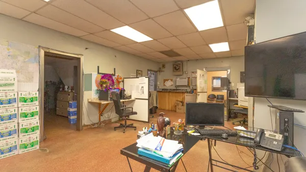 a view of a workspace with furniture