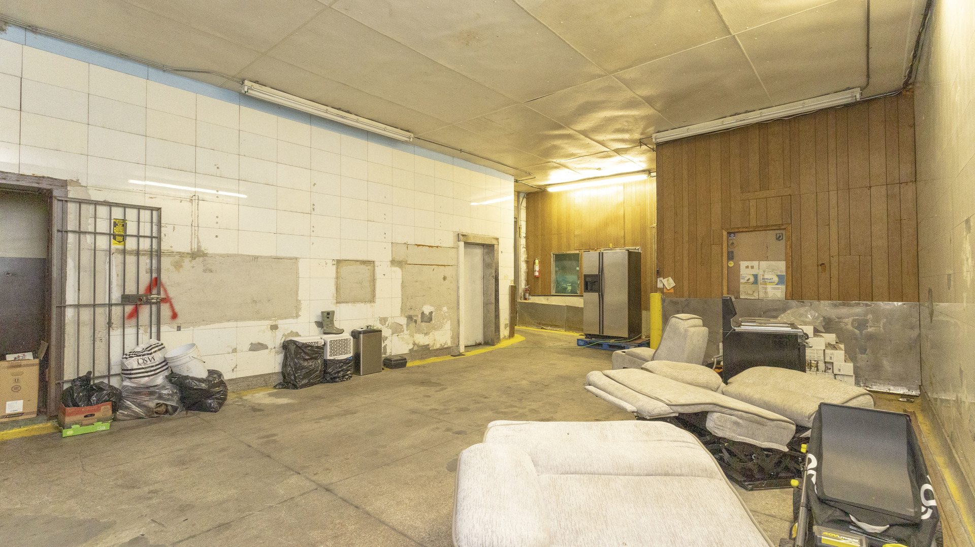 3612 West Roosevelt Road Chicago, IL 60624 - Photo 27 of 32 a bed room with a bed and a couch