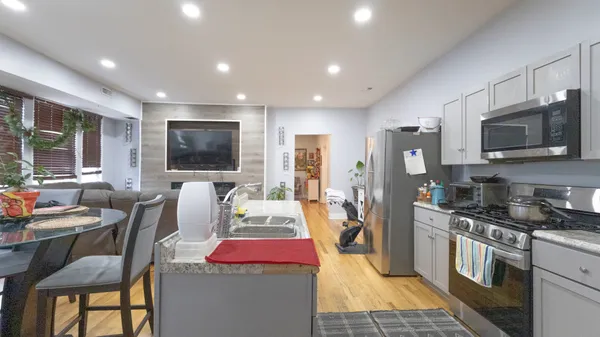 a very nice looking kitchen with a large window
