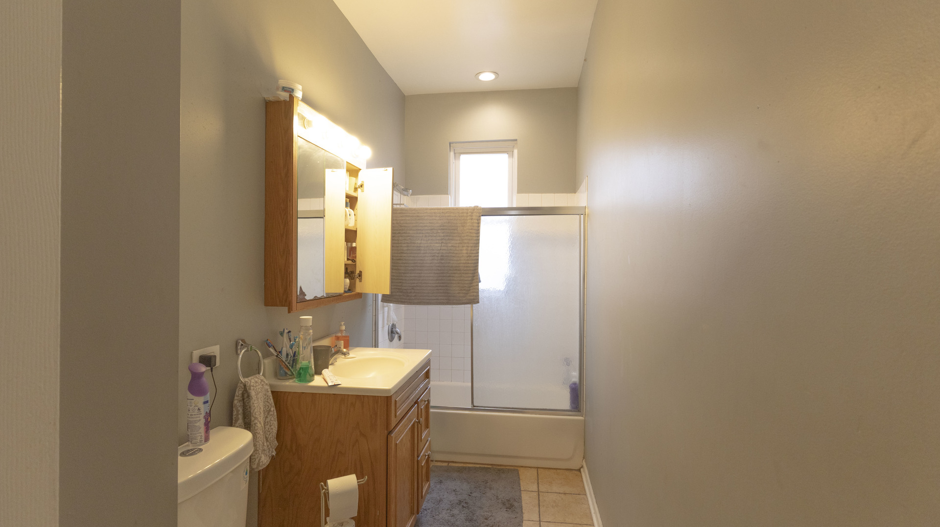 3612 West Roosevelt Road Chicago, IL 60624 - Photo 10 of 32 a bathroom with a sink a mirror and a bathtub