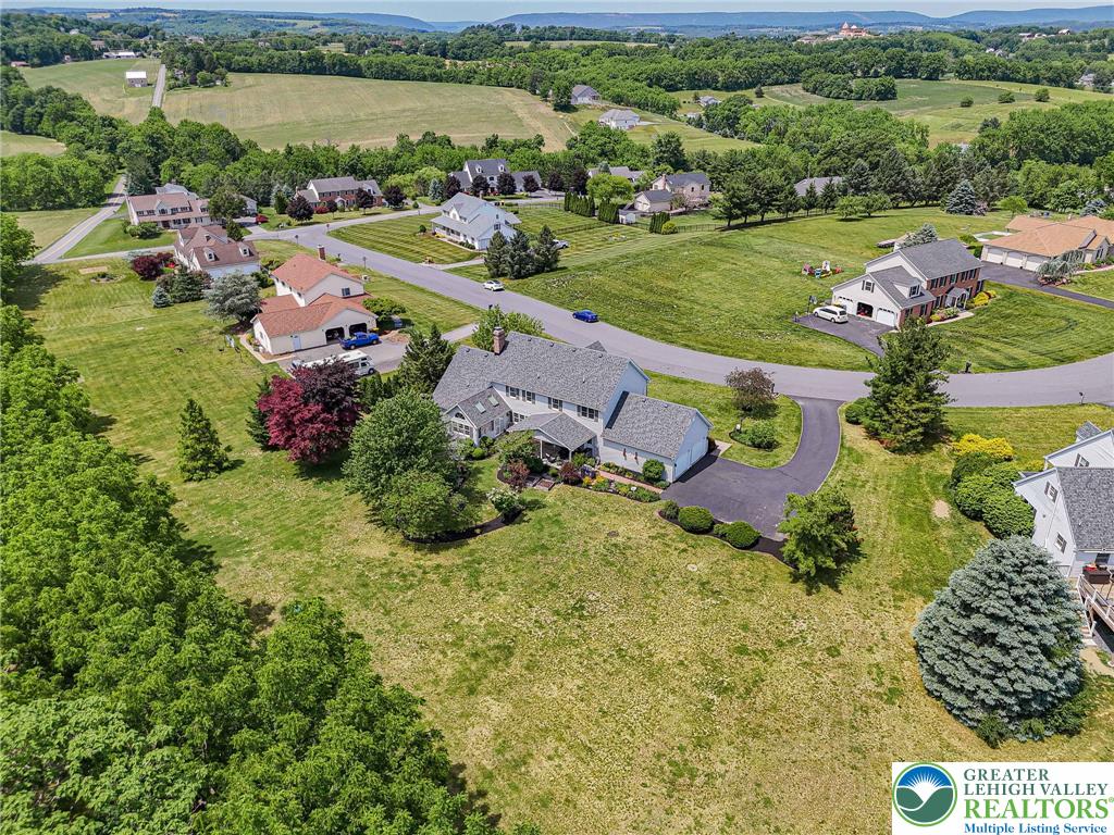 4542 Springfield Drive Coplay, PA 18037 - Photo 79 of 89 Discover a private residence nestled amidst a vibrant green landscape, offering serene views.