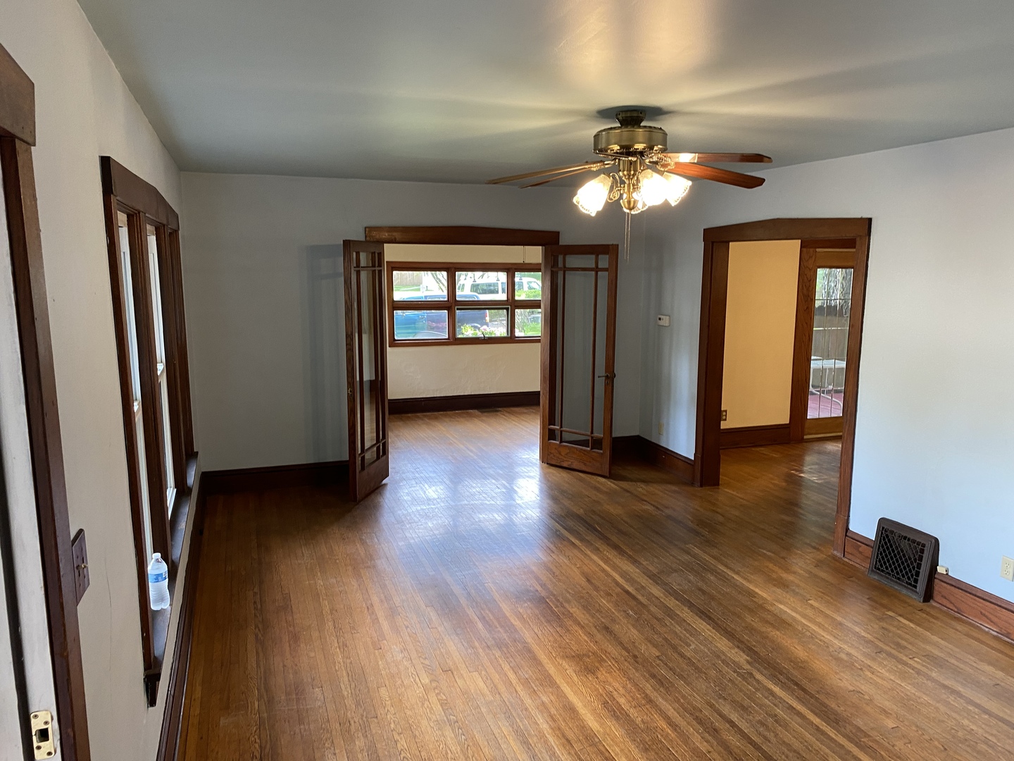 22 Payne Place Normal, IL 61761 - Photo 4 of 26 a view of an empty room with wooden floor and a window