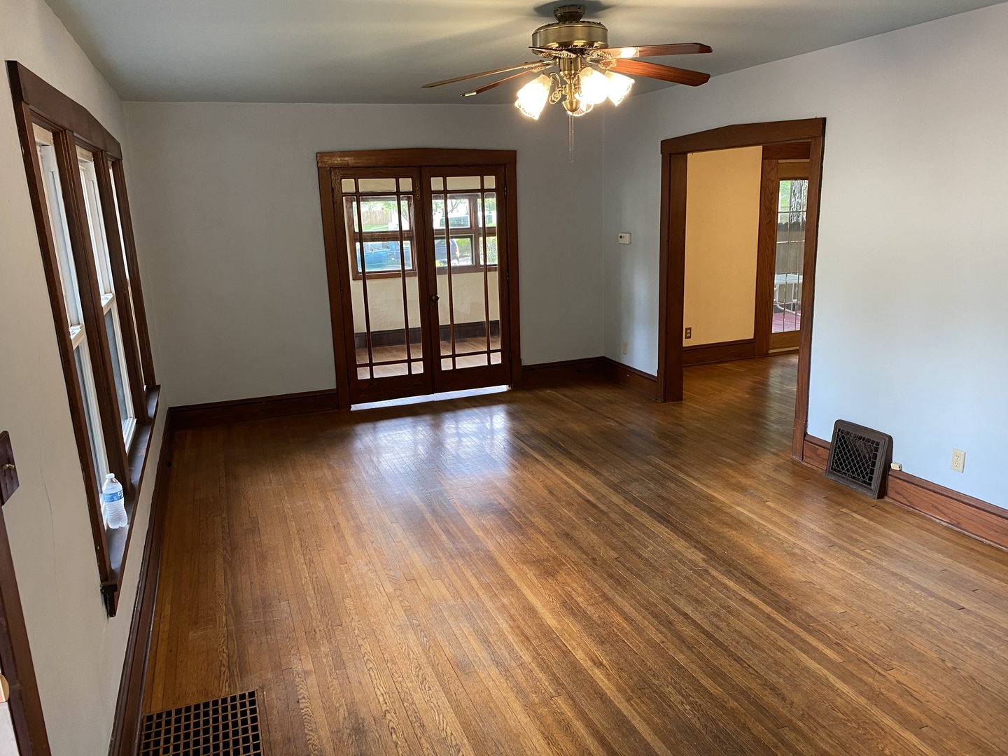 22 Payne Place Normal, IL 61761 - Photo 5 of 26 a view of an empty room with wooden floor and a window