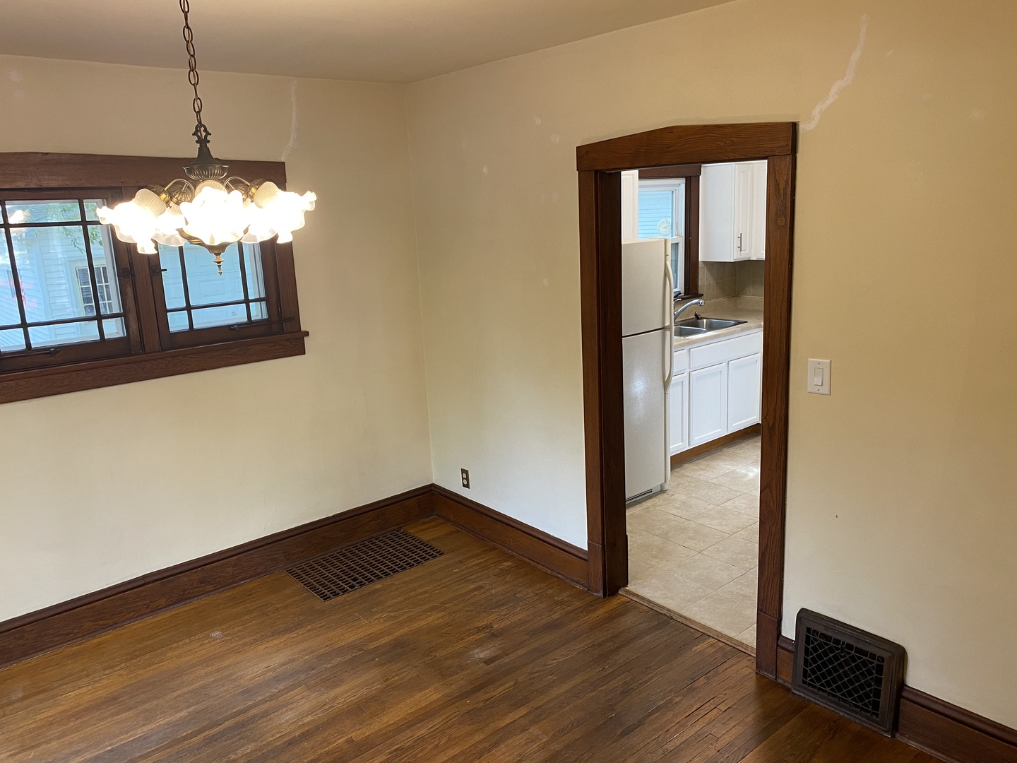 22 Payne Place Normal, IL 61761 - Photo 7 of 26 a view of a hallway with wooden floor and a dining room