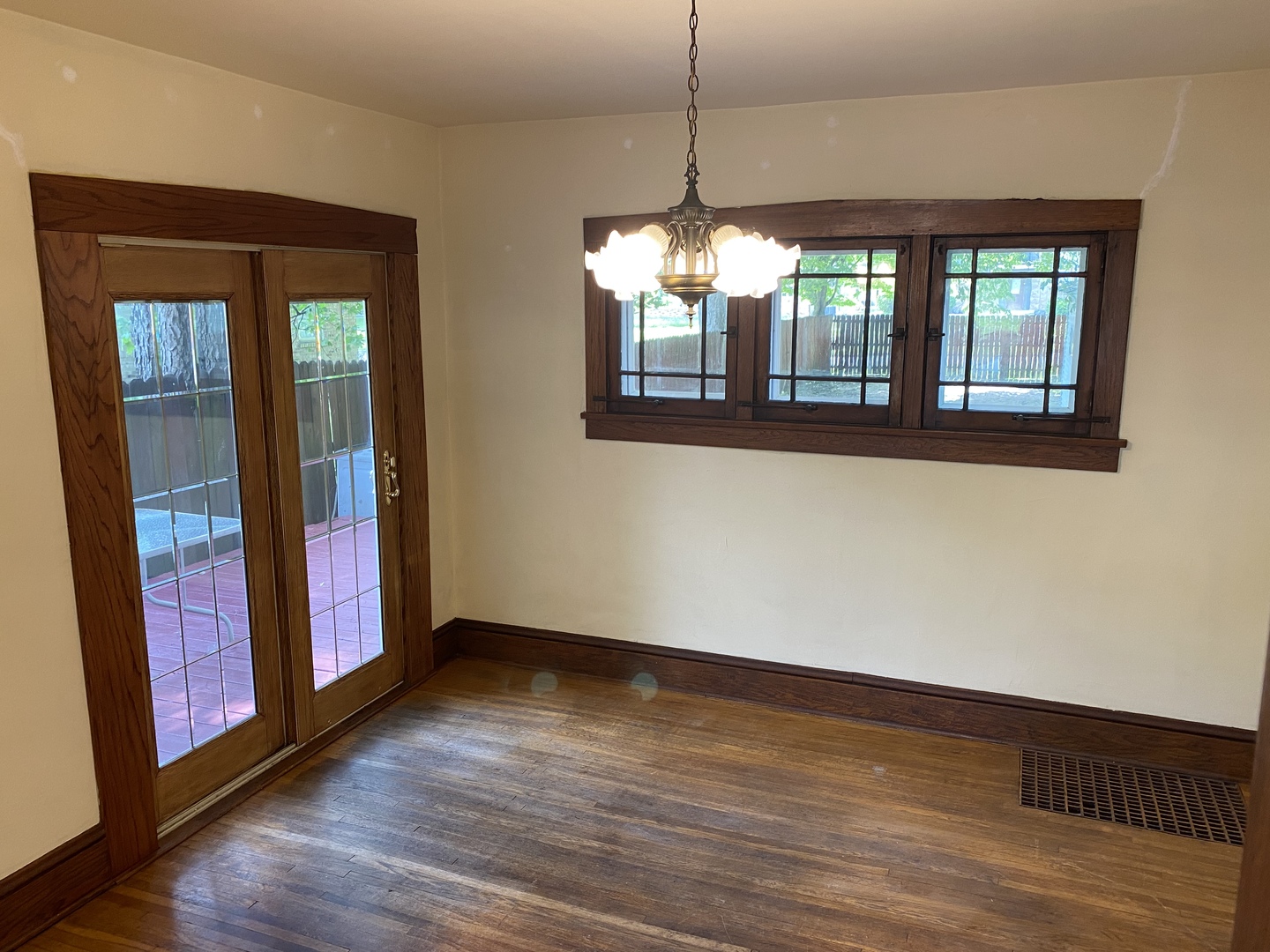 22 Payne Place Normal, IL 61761 - Photo 8 of 26 a view of an empty room with wooden floor and a window