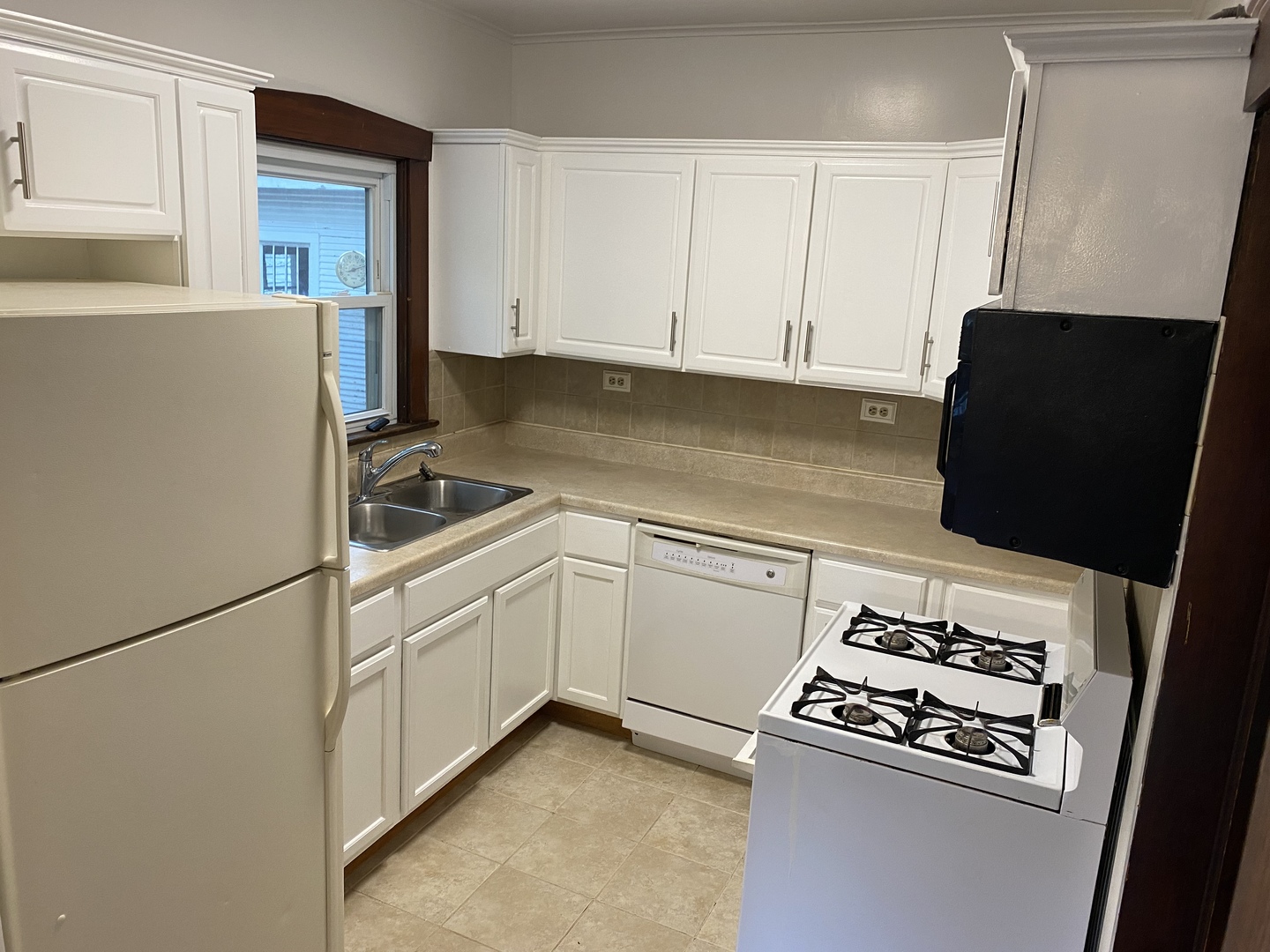 22 Payne Place Normal, IL 61761 - Photo 9 of 26 a kitchen with cabinets and white appliances