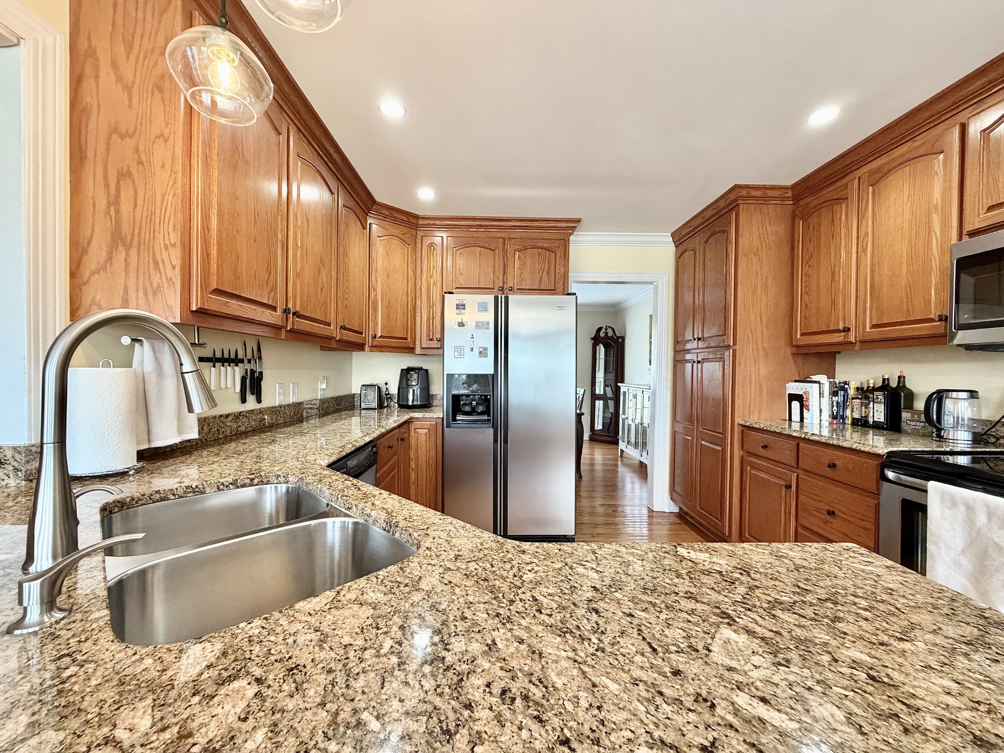 101 Mimi Circle Pulaski, TN 38478 - Photo 12 of 56 a kitchen with kitchen island granite countertop a sink stainless steel appliances and cabinets