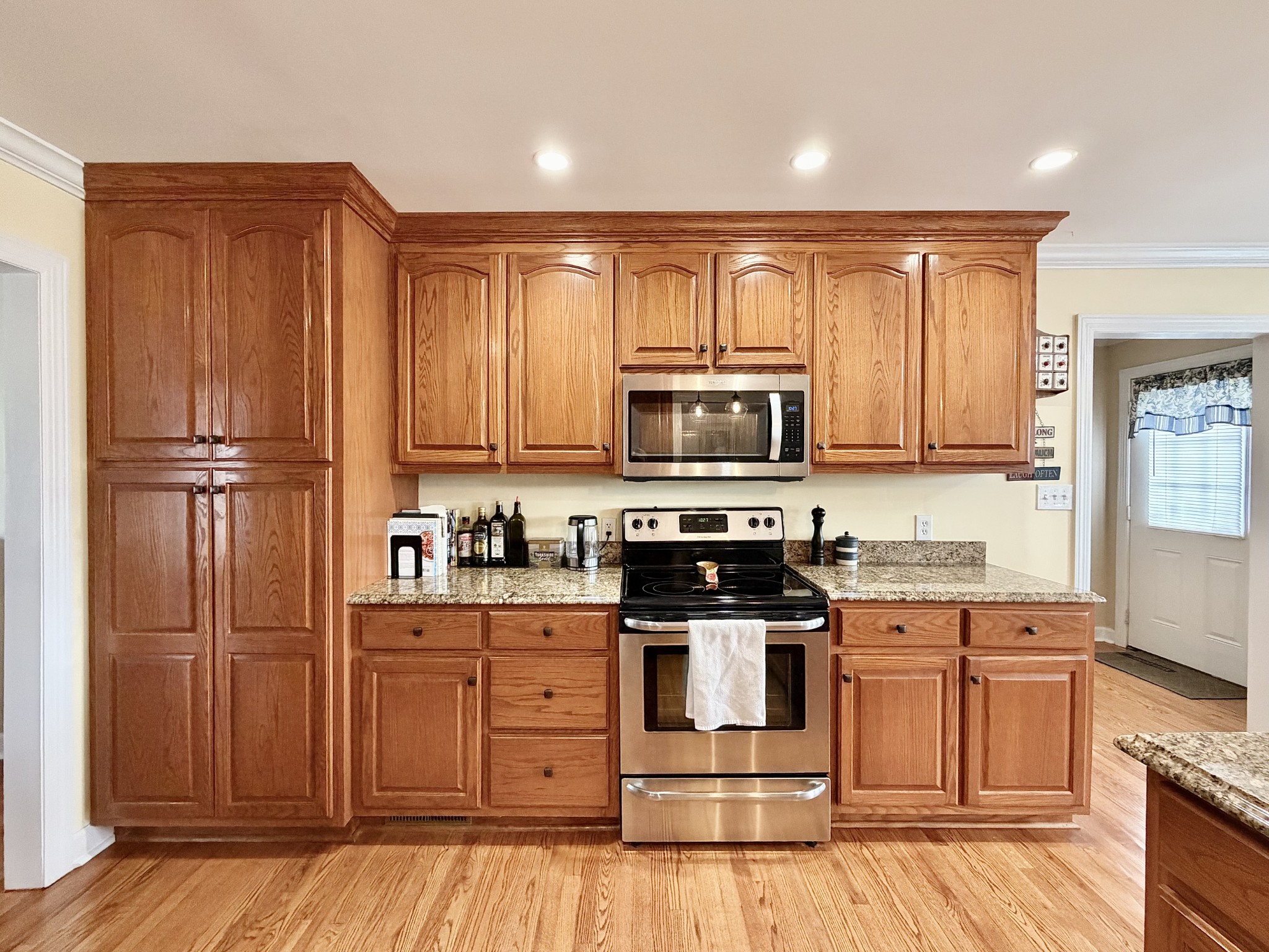 101 Mimi Circle Pulaski, TN 38478 - Photo 13 of 56 a kitchen with stainless steel appliances granite countertop a stove top oven and sink