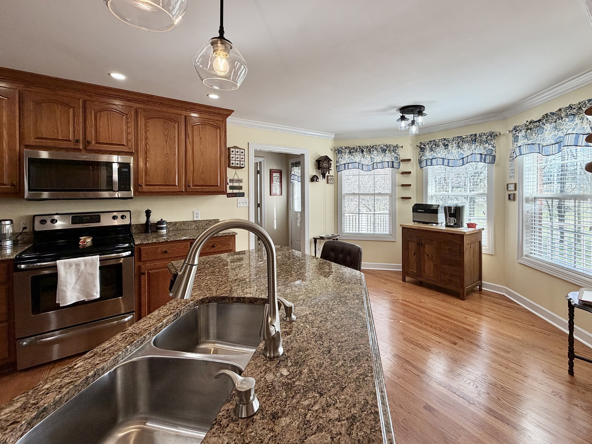 101 Mimi Circle Pulaski, TN 38478 - Photo 15 of 56 a kitchen with granite countertop a stove a sink and a microwave