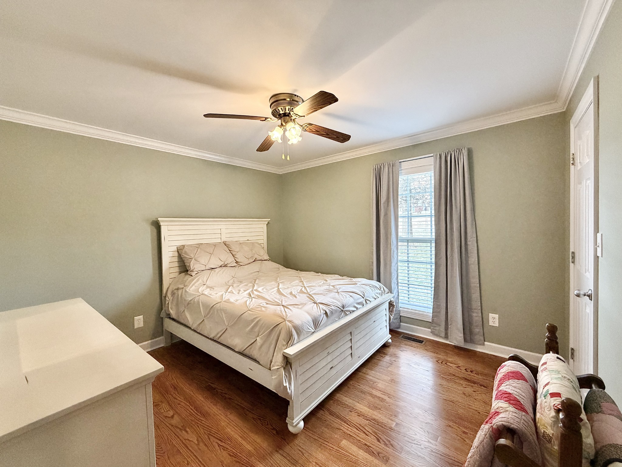 101 Mimi Circle Pulaski, TN 38478 - Photo 33 of 56 a bedroom with a bed and a chandelier