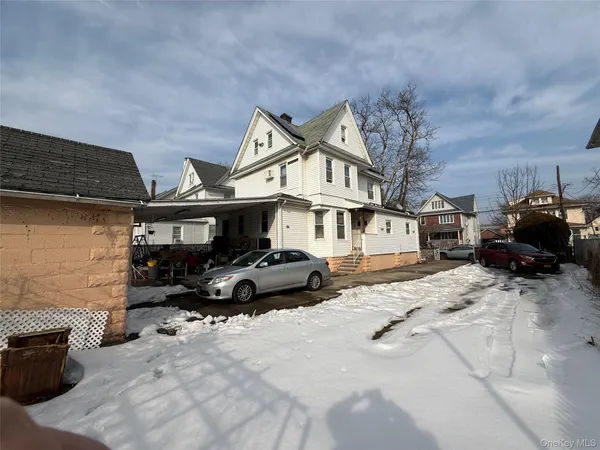a car parked in front of a house