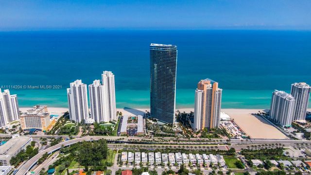 a front view of a building with garden