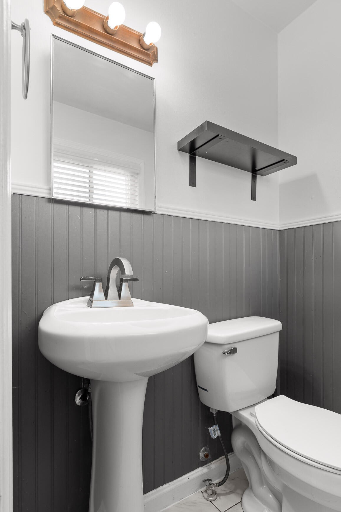 45 Virginia Avenue Rossville, GA 30741 - Photo 19 of 28 a bathroom with a toilet a sink and mirror