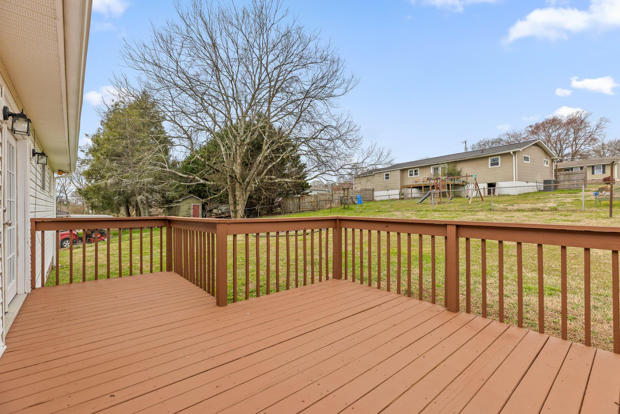 45 Virginia Avenue Rossville, GA 30741 - Photo 24 of 28 a balcony with wooden floor and fence