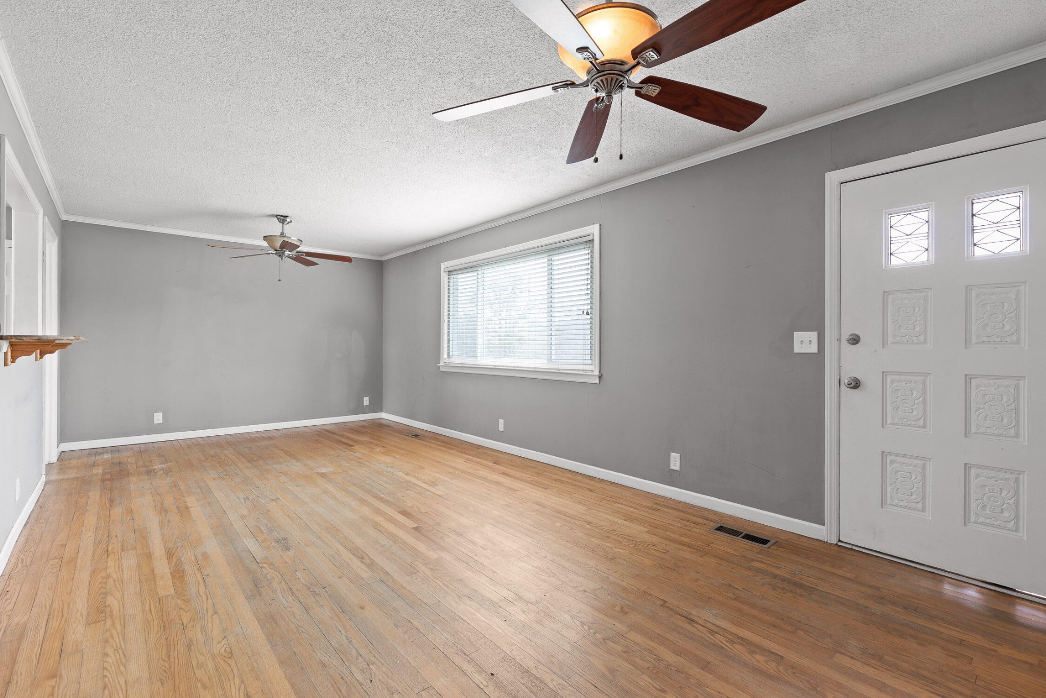 45 Virginia Avenue Rossville, GA 30741 - Photo 4 of 28 wooden floor in an empty room with a window