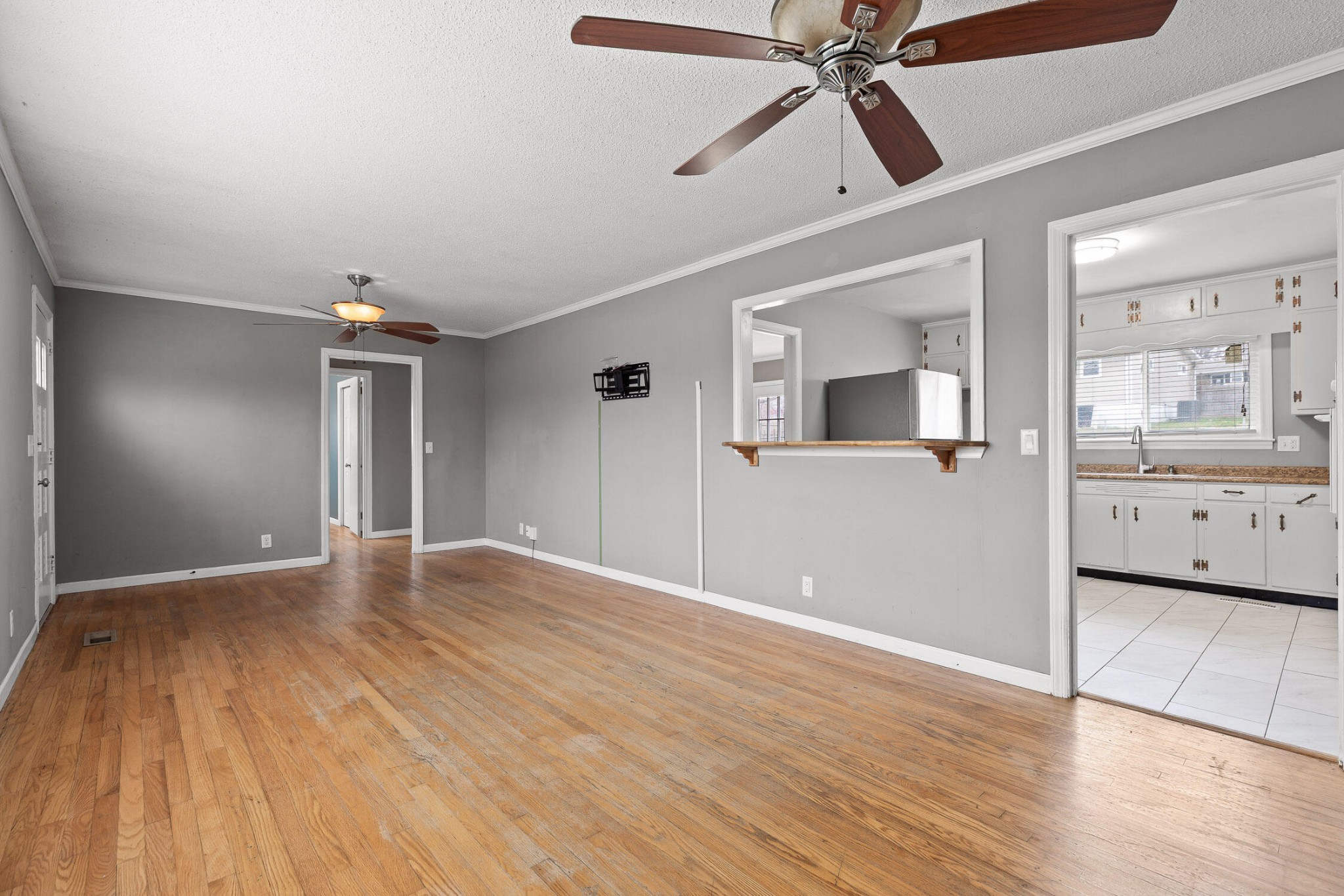 45 Virginia Avenue Rossville, GA 30741 - Photo 6 of 28 a view of a big room with wooden floor and a kitchen