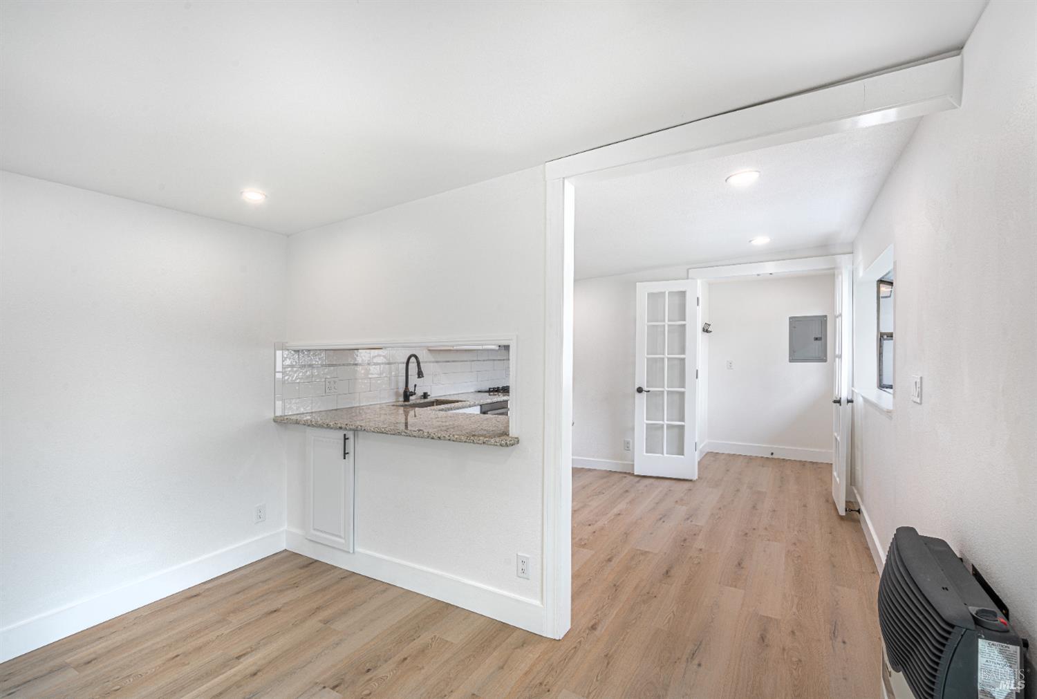 810 Brush Creek Road, Unit B Santa Rosa, CA 95404 - Photo 13 of 25 a view of a kitchen with a sink and wooden floor