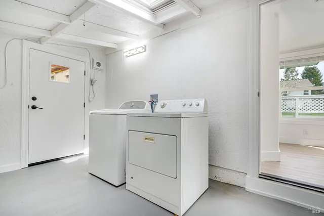 a view of a chairs and table in backyard