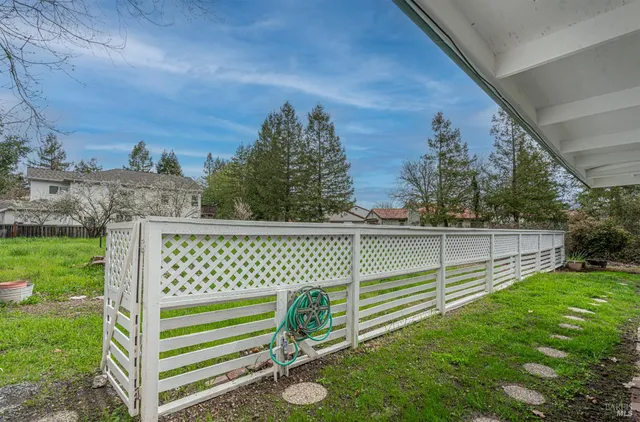 a view of a deck with a big yard