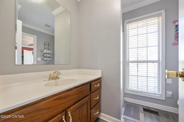 a bathroom with a sink double vanity and a tub