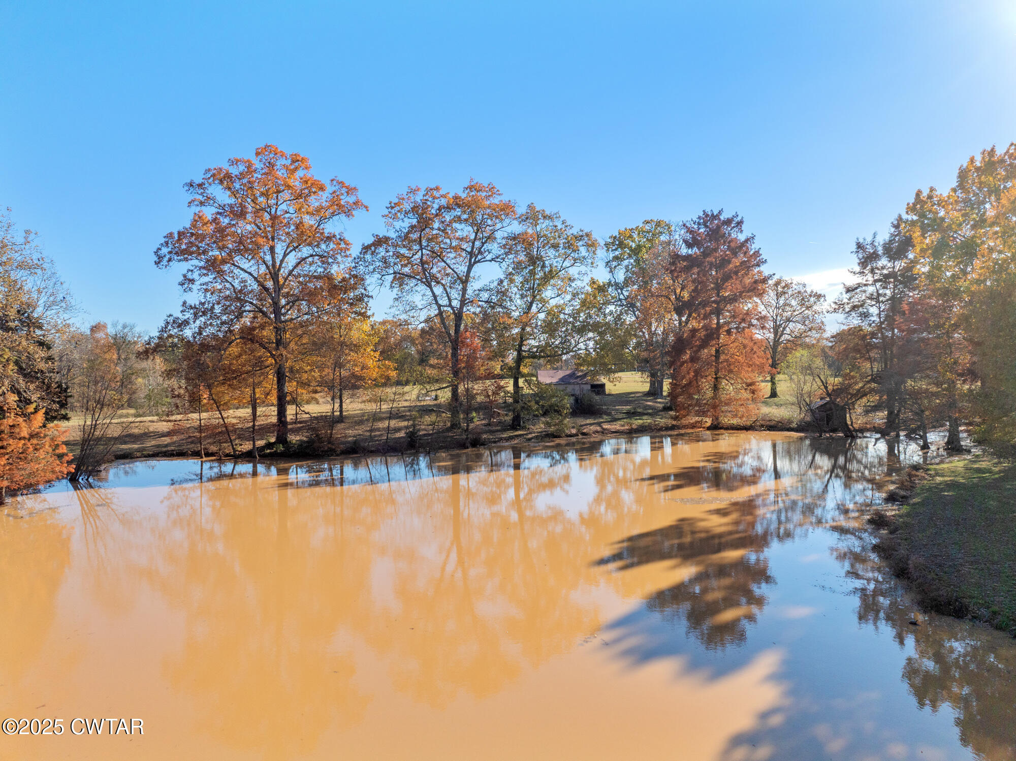 1100 Power Station Road Trezevant, TN 38258 - Photo 35 of 40 a view of a lake with houses