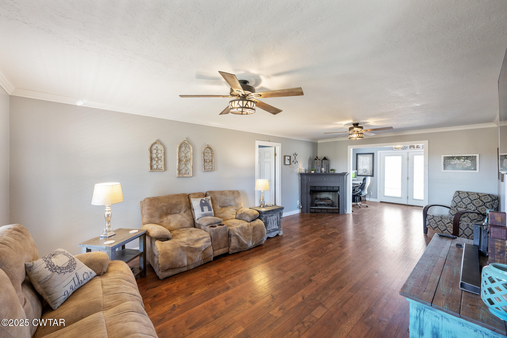 1100 Power Station Road Trezevant, TN 38258 - Photo 4 of 40 a living room with furniture and a fireplace