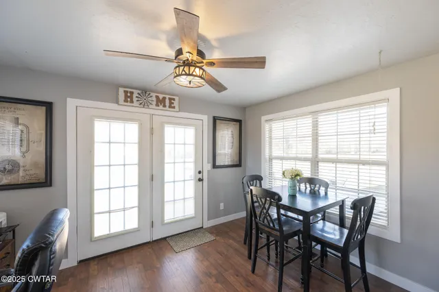 a view of a dining room with furniture window and wooden floor