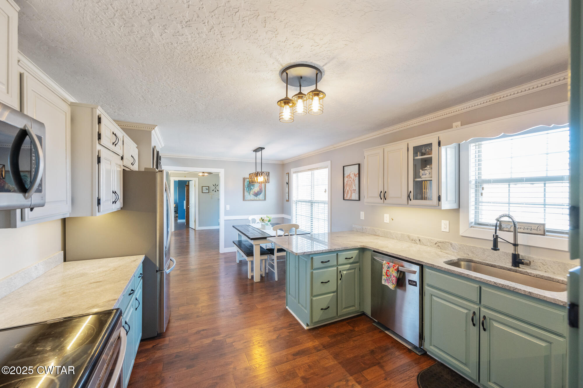 1100 Power Station Road Trezevant, TN 38258 - Photo 9 of 40 a kitchen with a sink appliances and cabinets