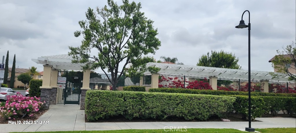 11305 Riverleaf Drive Riverside, CA 92505 - Photo 17 of 22 a front view of a house with a garden and plants