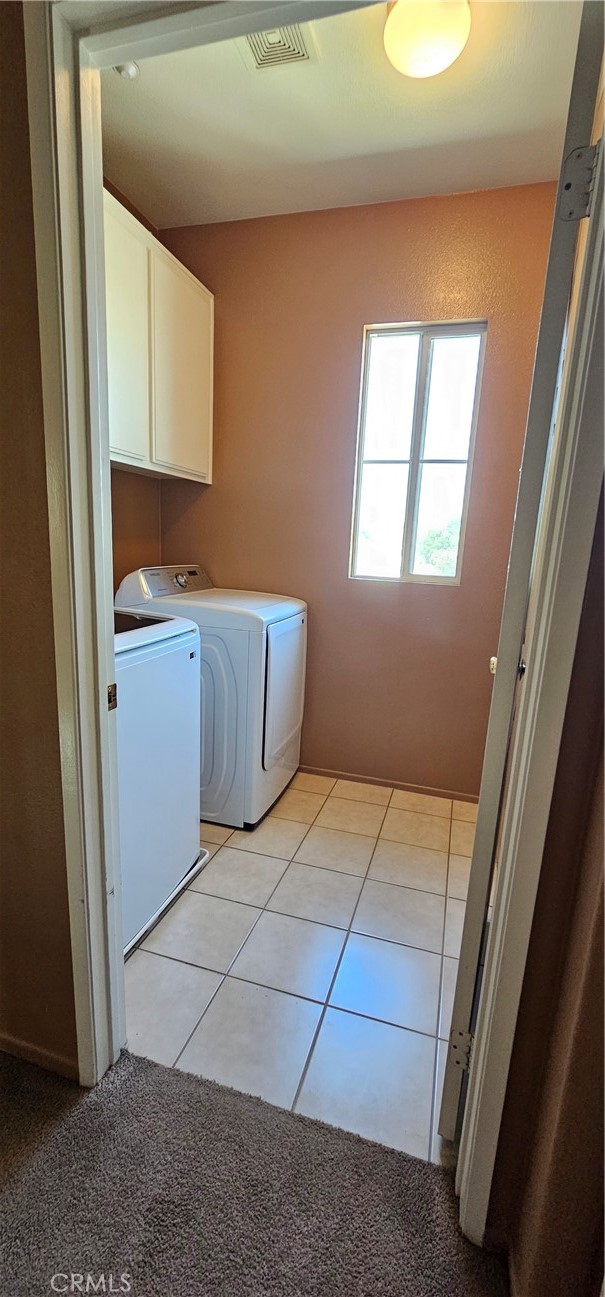 11305 Riverleaf Drive Riverside, CA 92505 - Photo 19 of 22 a kitchen with a stove top oven cabinets and a window