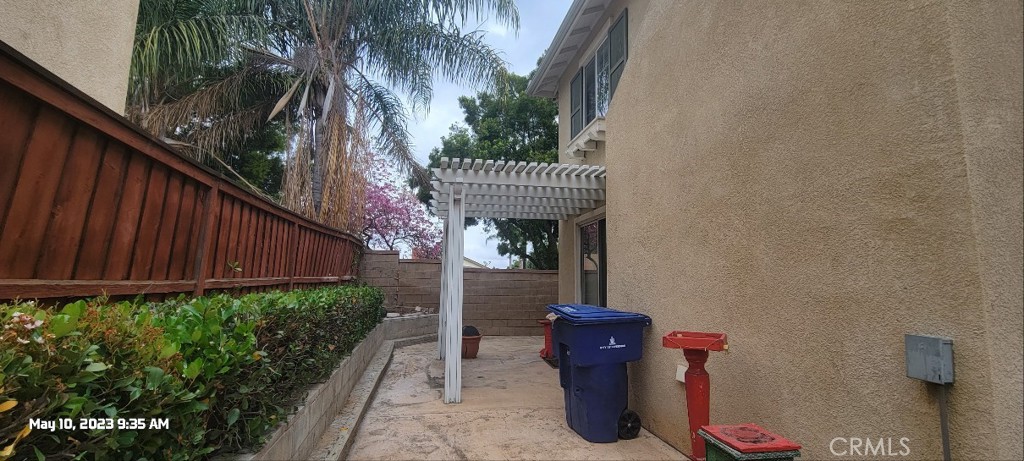11305 Riverleaf Drive Riverside, CA 92505 - Photo 3 of 22 a view of a pathway of the house with potted plants