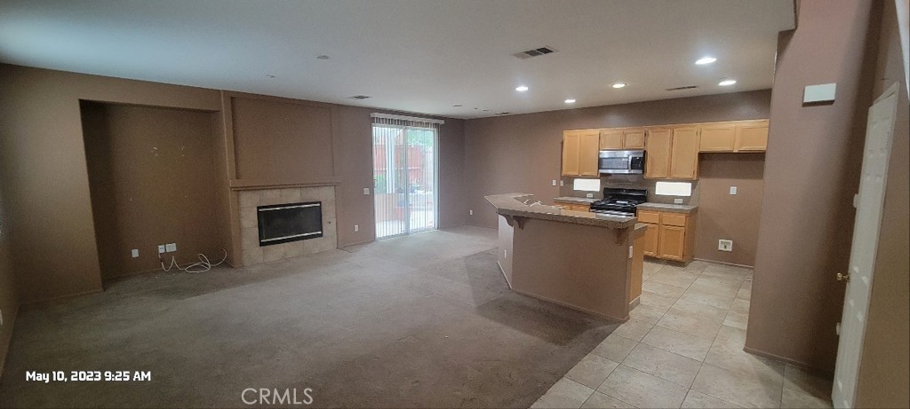 11305 Riverleaf Drive Riverside, CA 92505 - Photo 5 of 22 a kitchen with stainless steel appliances granite countertop a stove a sink and a refrigerator